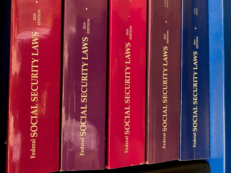 A shelf of Federal Social Security Laws volumes